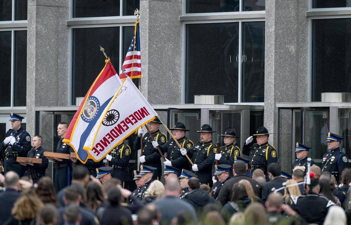Law enforcement officers salute the casket of Independence police officer Cody Allen on Friday, March 8, 2024, in Independence. Allen was fatally shot during an eviction in northeast Independence last week.