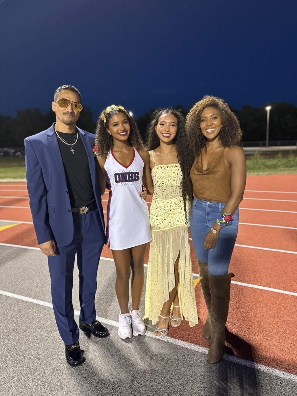 Pictured after an Olathe North football game, Avani Hocker Singh’s family includes dad Thomas Hocker (from left), older sister Anjali Hocker Singh, Avani and mom Meena Singh.
