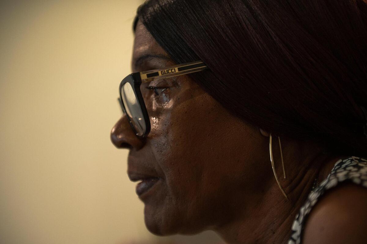 Vivian Jackson tears up while talking about the problems she has had with flooding and being forced to move from her apartment at the Emmanuel Cleaver II Senior Living Community in Kansas City.