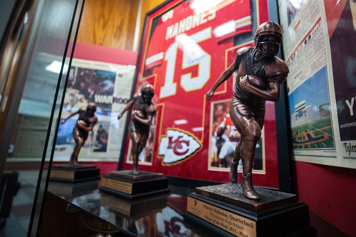 Trophies and Patrick Mahomes’ jersey are displayed in the hall at Whitehouse High School in east Texas.