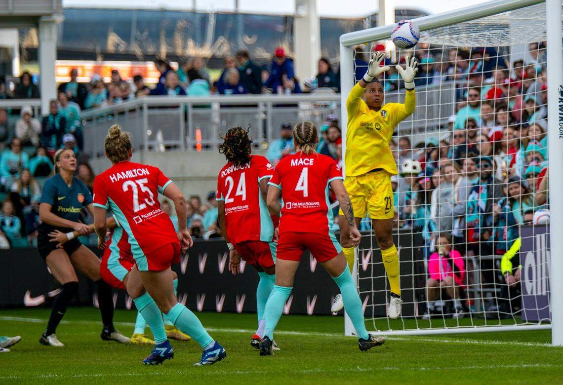 Kansas City Current goalkeeper Adrianna “AD” Franch (21) prevents a goal during the home opener against the Portland Thorns at CPKC Stadium on Saturday, March 16, 2024, in Kansas City.