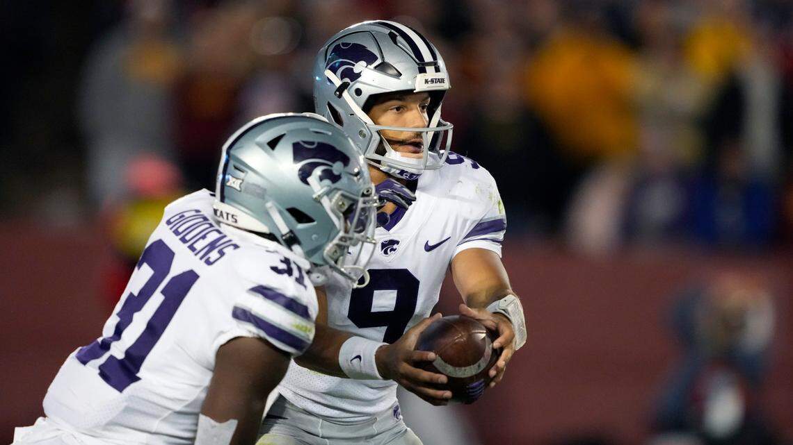 Kansas State quarterback Adrian Martinez (No. 9) hands off to running back DJ Giddens during Saturday night’s game against the Iowa State Cyclones in Ames, Iowa. Martinez has been extremely productive since transferring to Kansas State.
