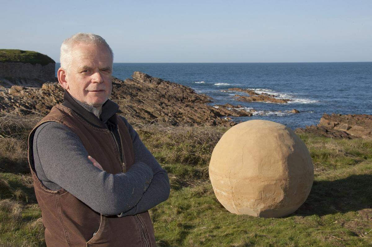 Artist Andy Goldsworthy at the start of his Alderney Stones project in the Channel Islands.