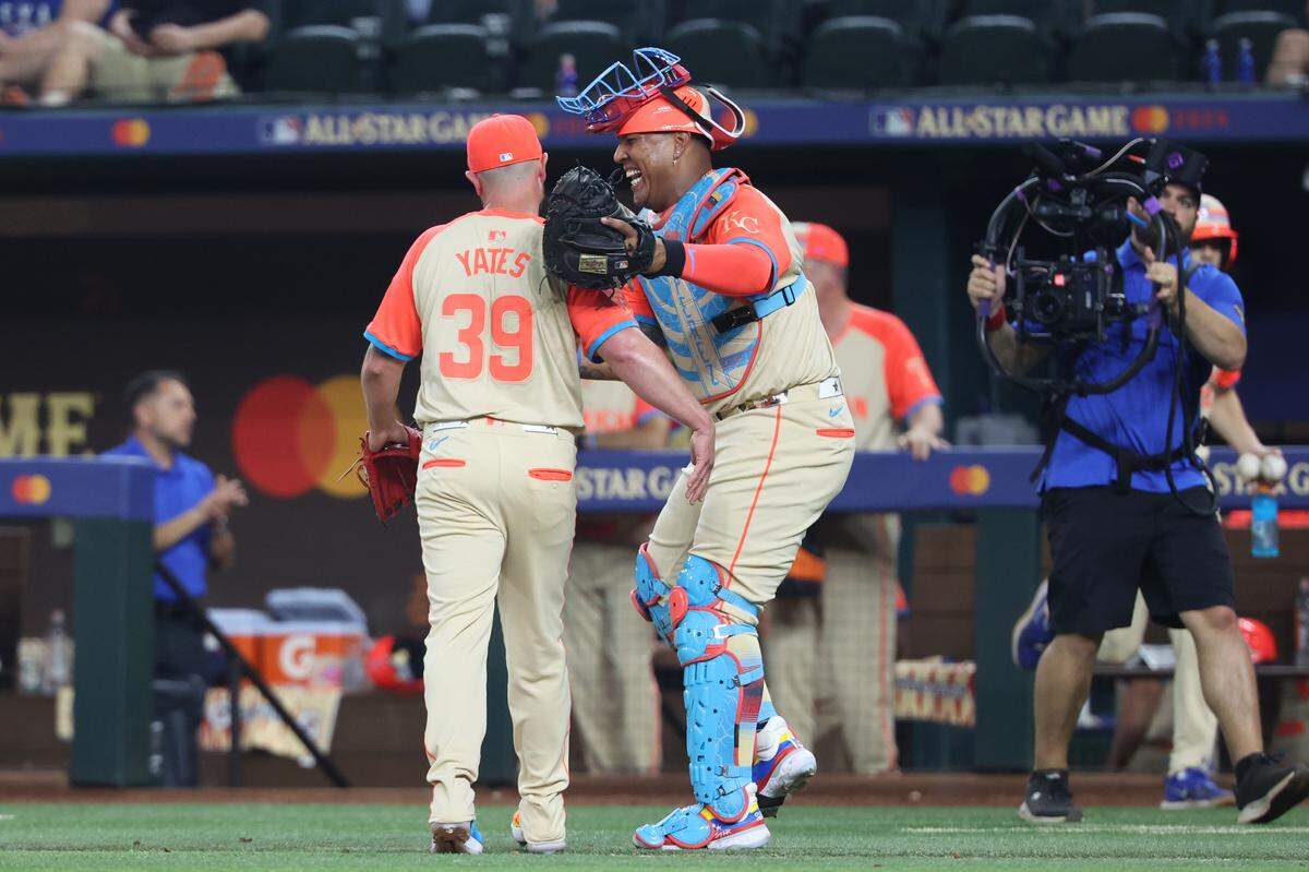 American League pitcher Kirby Yates of the Texas Rangers (39) and catcher Salvador Perez&nbsp;of the Kansas City Royals (13) react in the eighth inning during the 2024 MLB All-Star game at Globe Life Field on July 16, 2024.