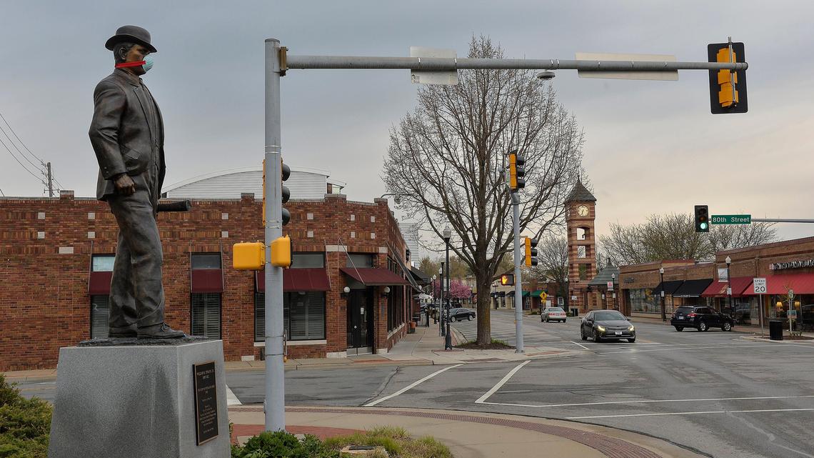 Adorned by a mask, the statue of William Strang Jr., the founder of Overland Park, looks out over the historic downtown of the city. Santa Fe Drive, downtown’s main street, is lined with small businesses, most of them closed due to the stay-at-home order to prevent the spread of COVID-19.
