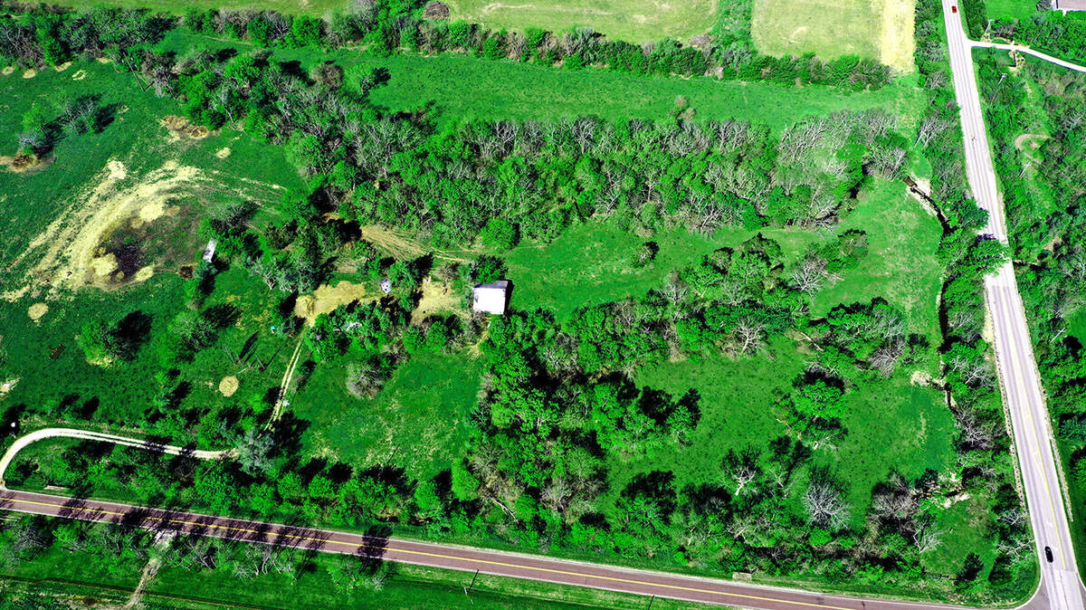 On the southwest corner of 199th Street and Antioch, lot #1 at Adams Farm offers over 16 acres of heavily wooded terrain ideal for a private estate home. 