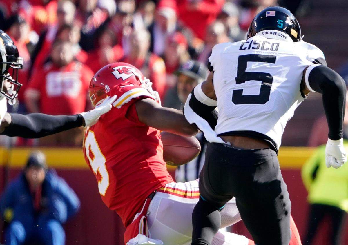 Chiefs wide receiver JuJu Smith-Schuster is driven to the turf after being hit hard by Jacksonville Jaguars safety Andre Cisco during Sunday’s game at GEHA Field at Arrowhead Stadium.