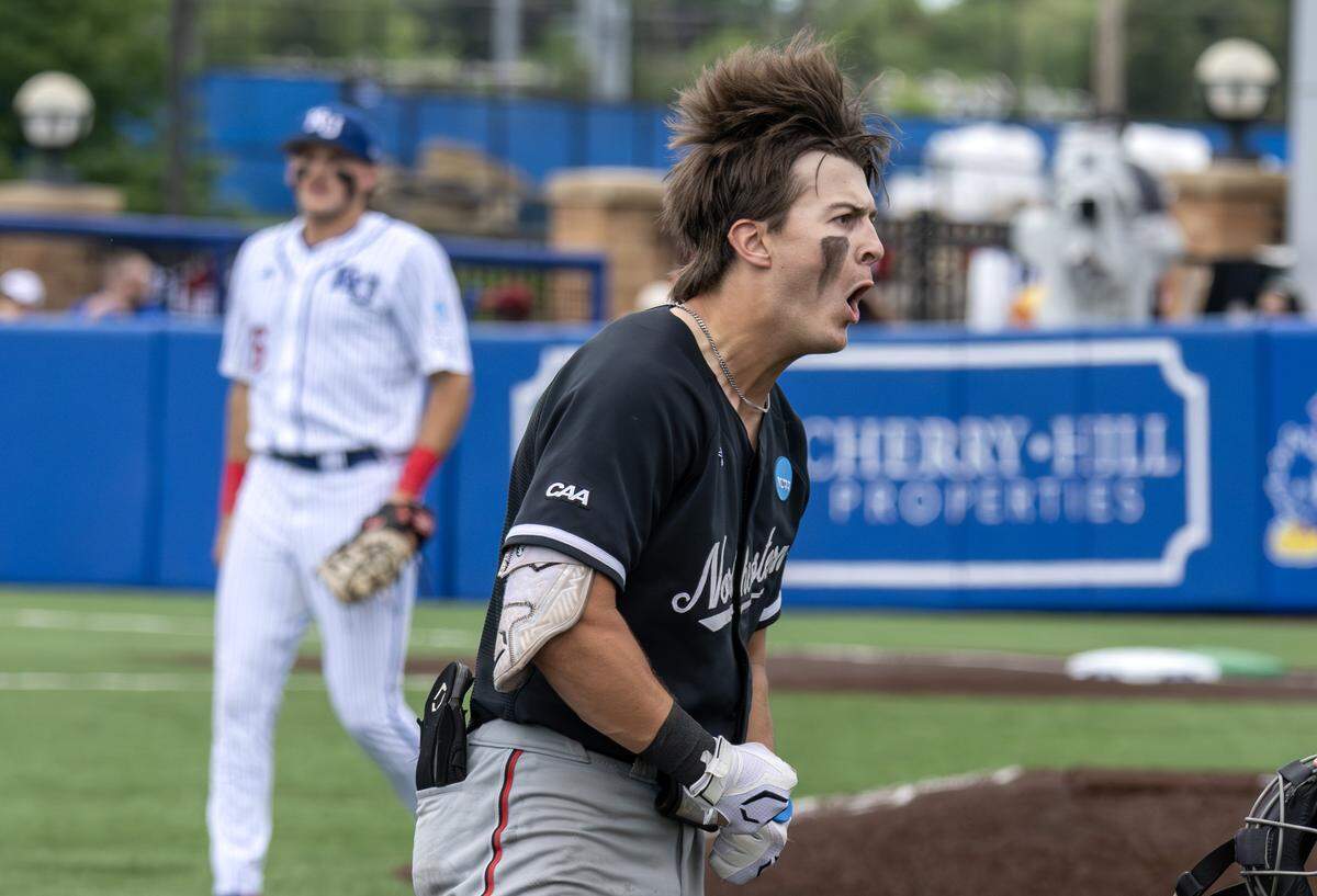 Northeastern Huskies outfielder Ryan Gerety (3) celebrates after hitting a triple against the Kansas Jayhawks in the fifth inning of an NCAA baseball tournament game at Hoglund Ballpark on Friday, May 29, 2026, in Lawrence, Kan.