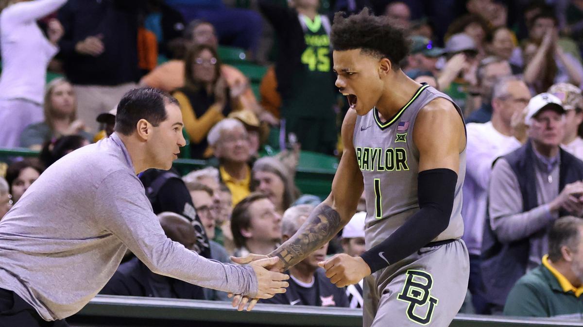 Baylor guard Keyonte George slaps hands with coach Scott Drew after a Bears score against Oklahoma State on Saturday, Jan. 14, 2023, in Waco, Texas.