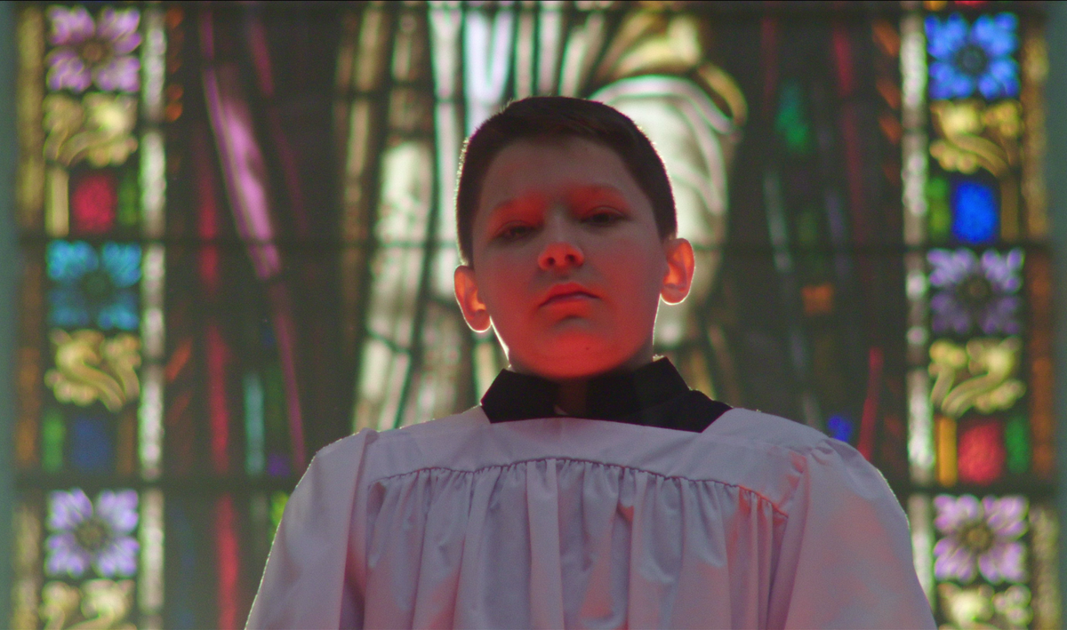 The six men who tell their stories of abuse in the documentary “Procession” decided to cast the same young actor, Terrick Trobough, to portray them in their boyhood years, “because we’re all that one boy,” one of the men said.