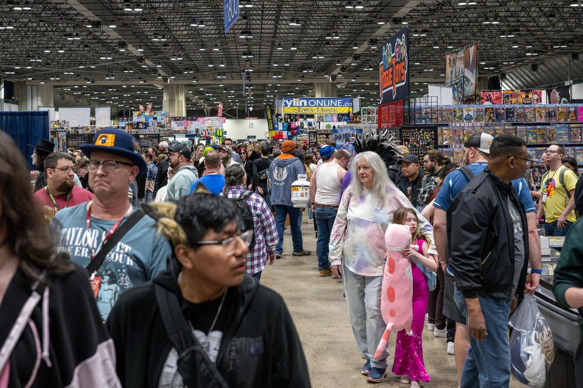 Visitors attend Planet Comicon at the Kansas City Convention Center on Friday, March 21.