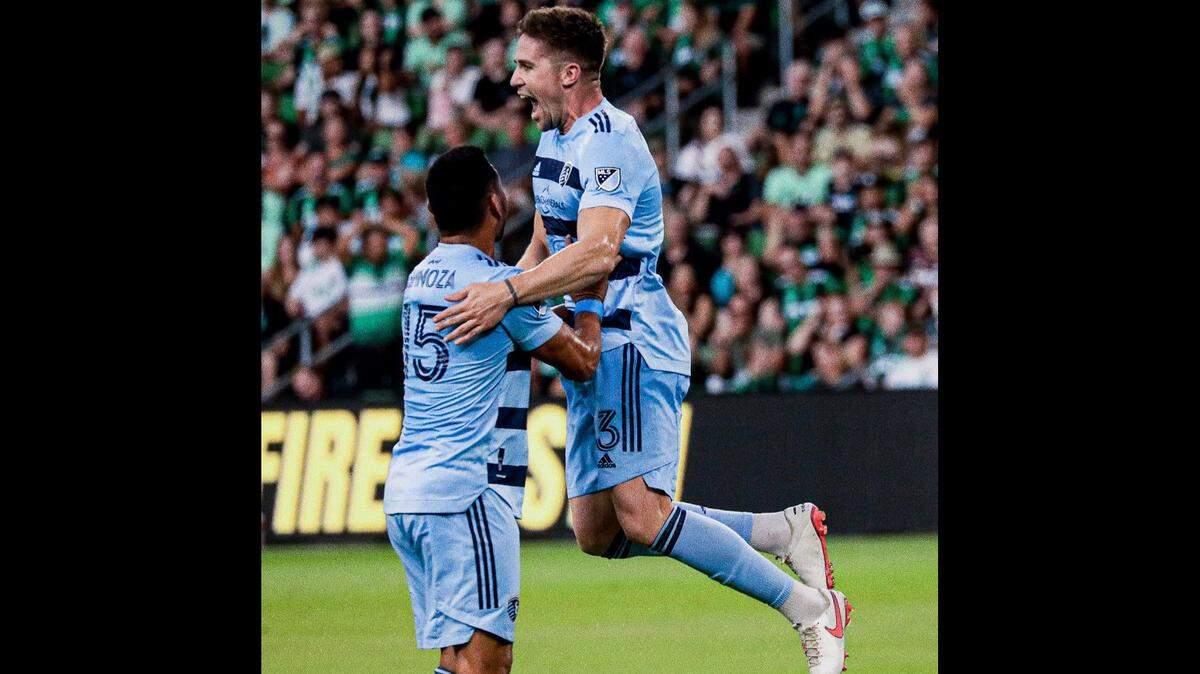 Defender Andreu Fontás, right, celebrates a goal for Sporting KC with teammate Roger Espinoza during a game in Austin this year.