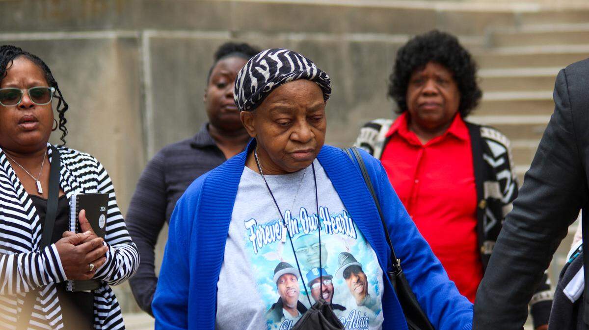 Ruby Smith, is seen wearing a t-shirt that says, “forever in our hearts,” with pictures of her son Charles Adair at the Wyandotte County Courthouse May 6, 2026. Adair’s family addressed the media after seeing body camera footage of a deputy kneeling on his back before his death.