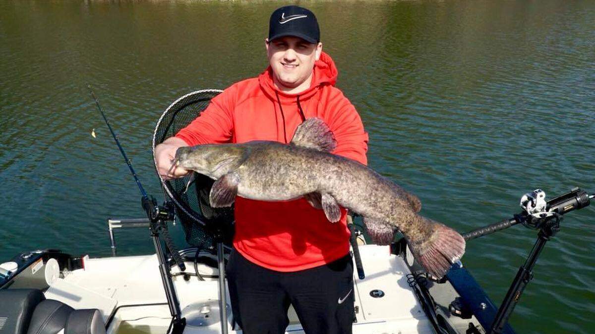 Jacob Haus shows off an unexpected surprise: a 25- to 30-pound flathead caught at Lake Jacomo while trolling for Walleye in 15 feet of water.