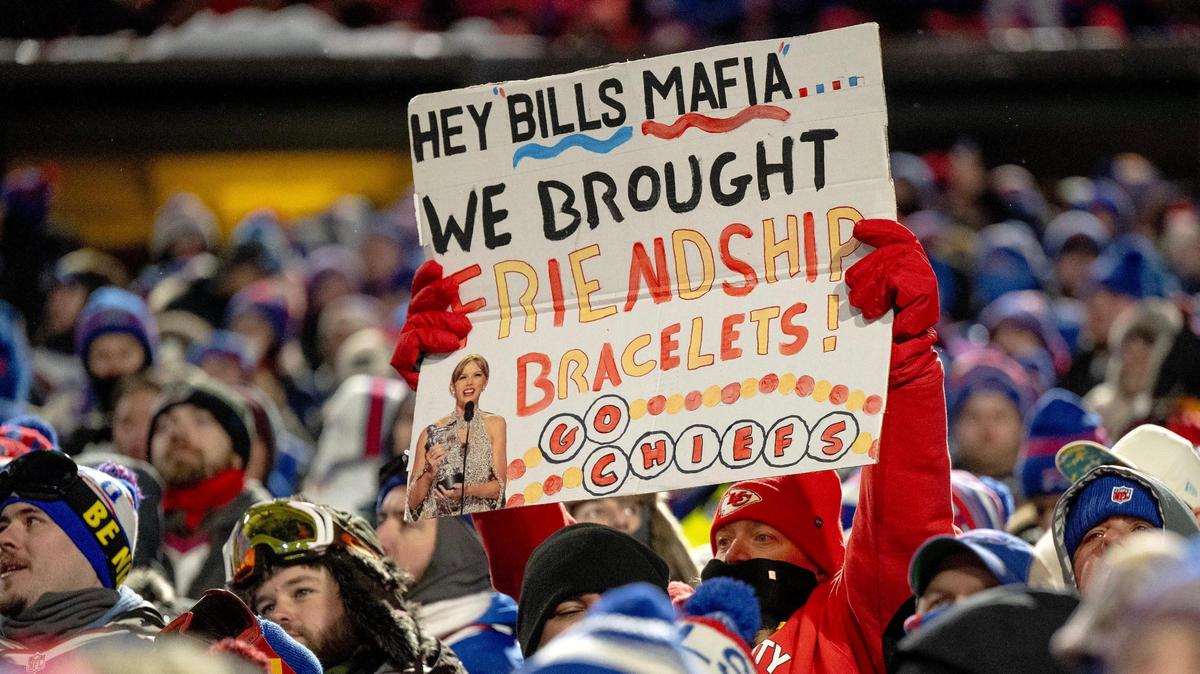 A Kansas City Chiefs fan holds up a sign during an AFC Divisional Round playoff game against the Buffalo Bills at Highmark Stadium on Sunday, Jan. 21, 2024, in Orchard Park, New York.