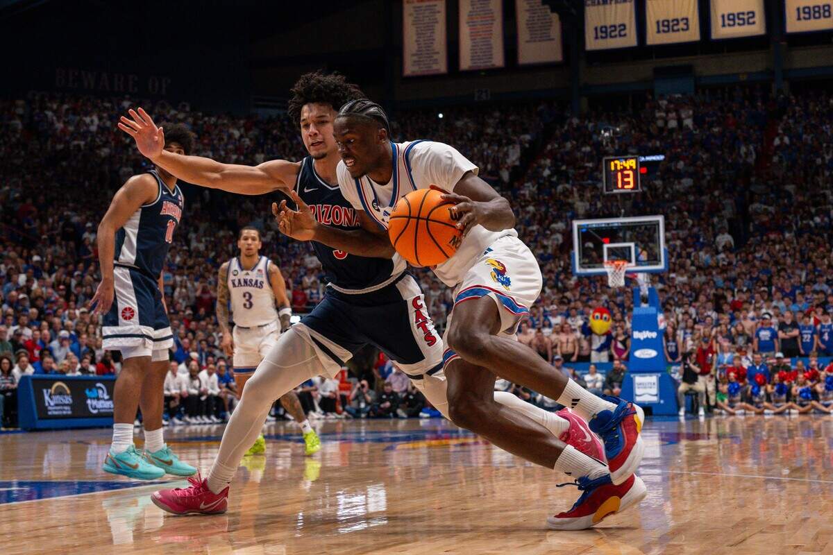Kansas Jayhawks forward Flory Bidunga drives at an Arizona defender on Monday, Feb. 9, 2026 inside Allen Fieldhouse in Lawrence.