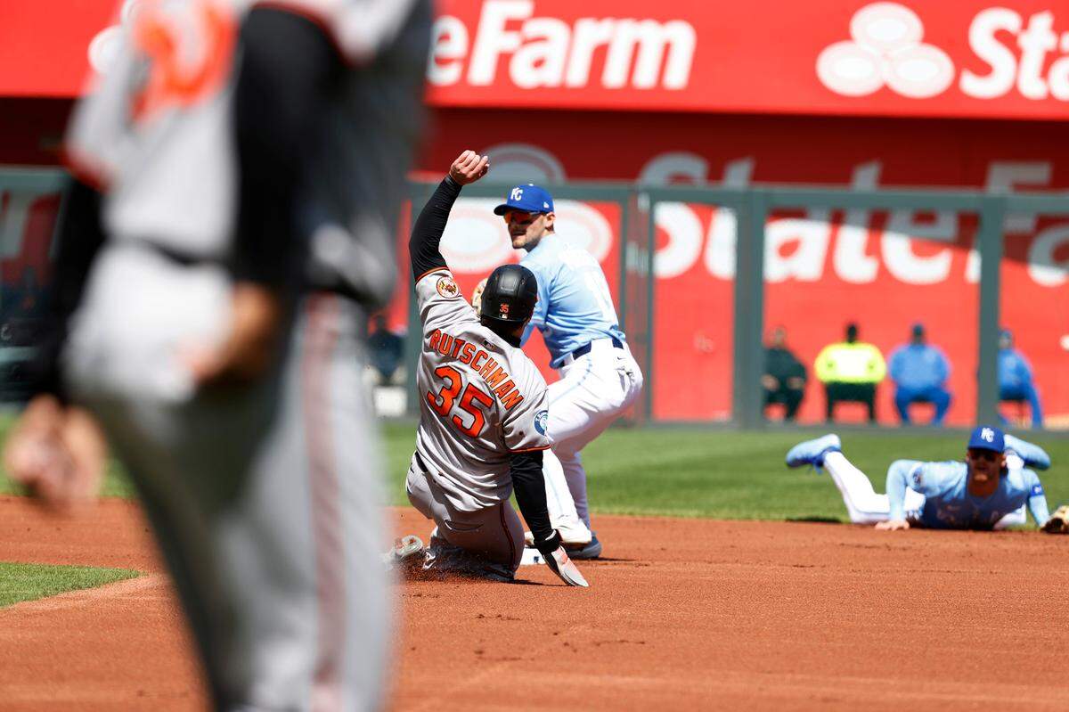 Royals infielder Michael Massey (pictured at center of photo) gets the out at second base on Baltimore Orioles catcher Adley Rutschman in a Major League Baseball game at Kauffman Stadium in Kansas City on Sunday, April 6, 2025.