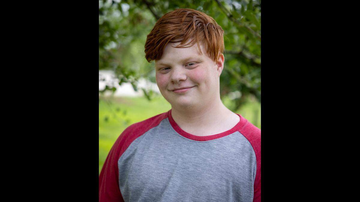 Eli, 16, likes to write and read poetry and enjoys staying active by playing volleyball and soccer.