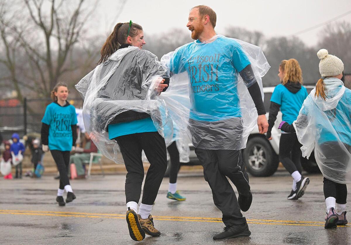Driscoll Irish Dancers didn’t let wet streets and rain dampen the festivities during the 2023 Brookside St. Patrick’s Day Warm-Up Parade on Saturday March 11, 2023 in Kansas City.