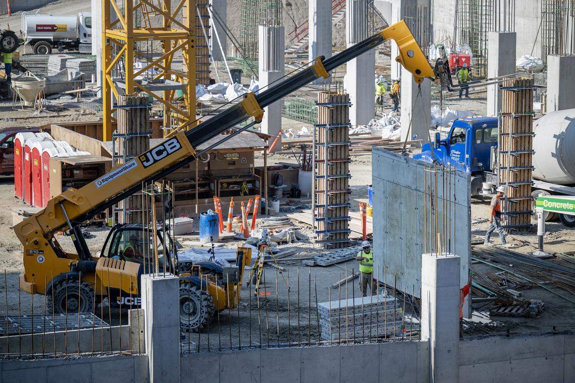 Construction crews moved a concrete panel at the Barney Allis Plaza in August. The project, set to be complete by the end of 2026, includes a new parking garage, a 3.3 acre park and 2.5 acres of new sidewalks and streetscapes.