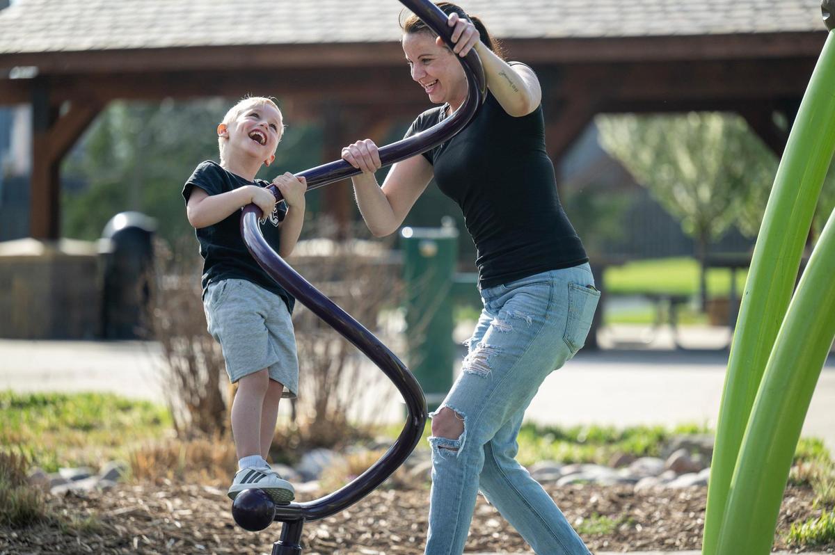 Jessica Alaga and her son, Kyrie, 4, enjoy time together at Raven Ridge Park on Thursday, April 18, 2025 in Olathe. Alaga, who lives in Spring Hill, Kansas, drives her son to child care in Olathe.