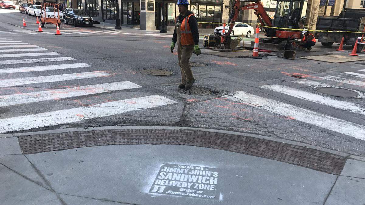 Jimmy John’s placed sidewalk ads around downtown, including this one across from its location at 1103 Grand Blvd., just a few blocks from the new Spokes Cafe & Cyclery.