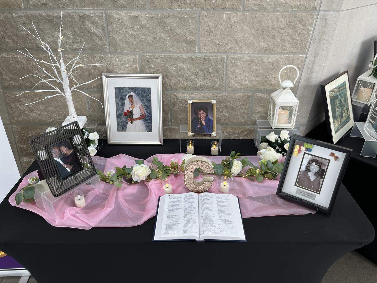 A table with photos is seen at the funeral of Cynthia Newsome on May 30, 2026.