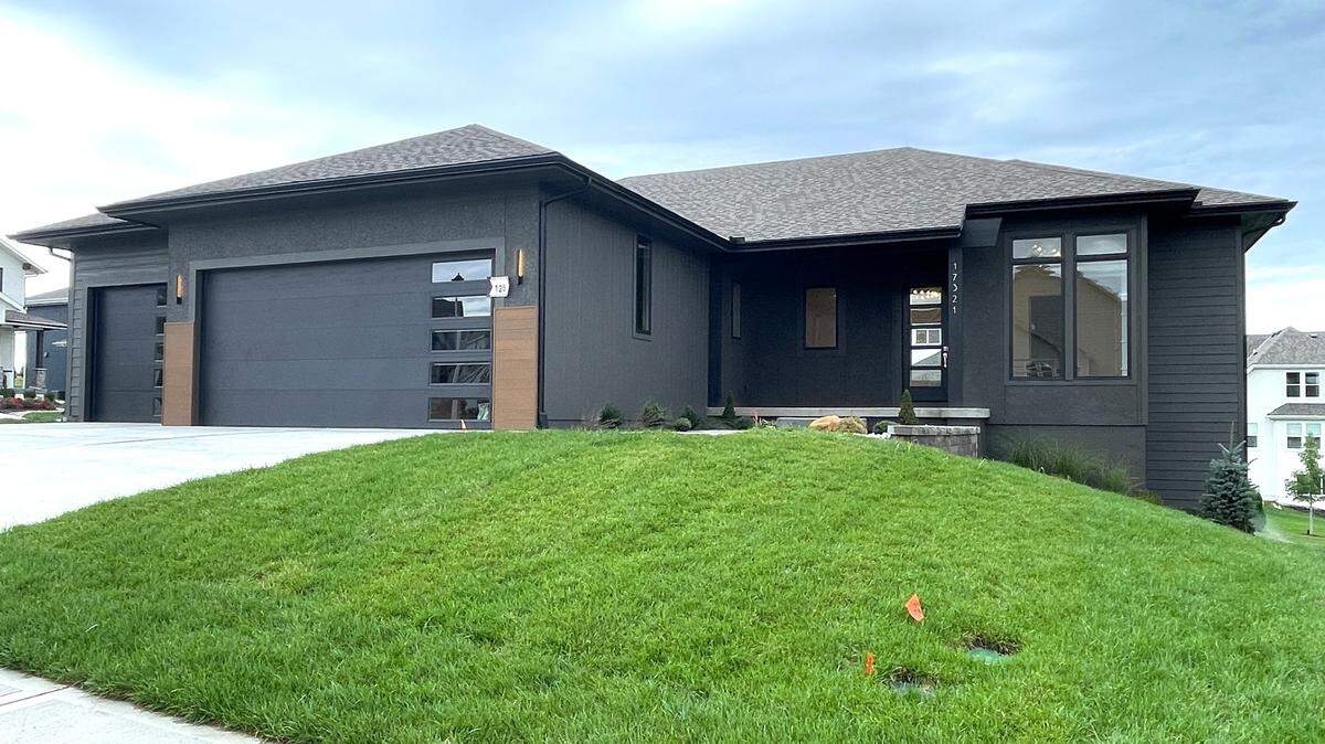 Doyle Construction’s newest Reverse 1.5-story plan, “The Jacobsen” features mid-century modern finishes, expansive open living spaces, a designer alcove kitchen, covered deck, walkout finished basement, wet bar and more.