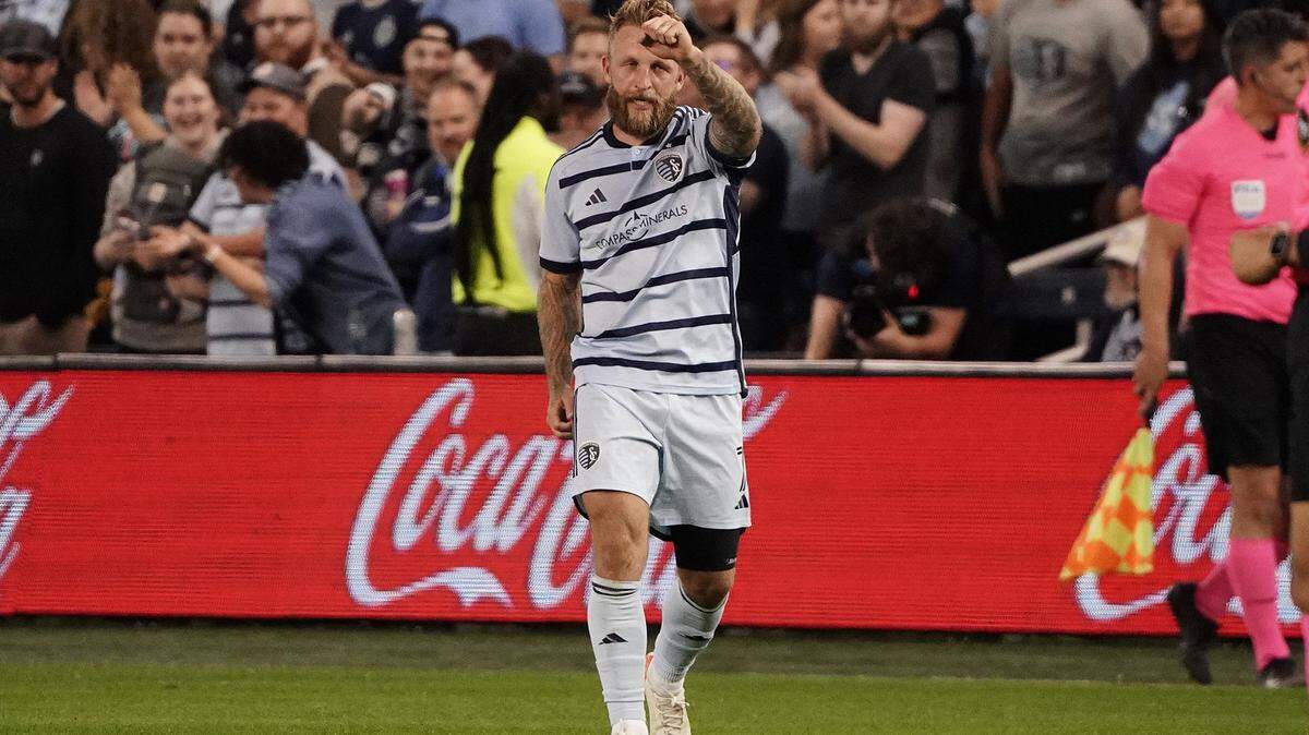 Sporting Kansas City forward Johnny Russell celebrates after scoring the first of his two goals against Minnesota United FC during Saturday night’s MLS match at Children’s Mercy Park.