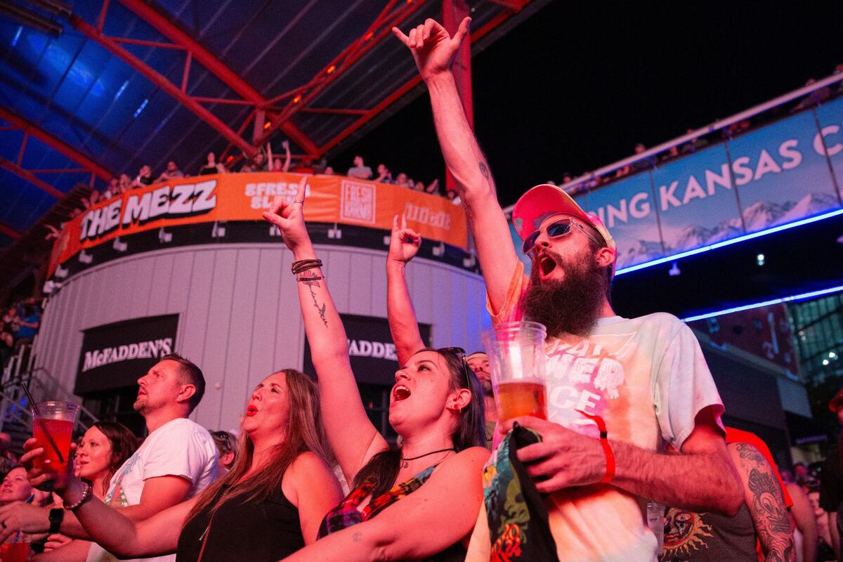 Cheyenne Bergman (center) and Dillon Edwards cheer during a performance by Soul Rebel and the Beast before Sublime with Rome at Kansas City Power & Light.
