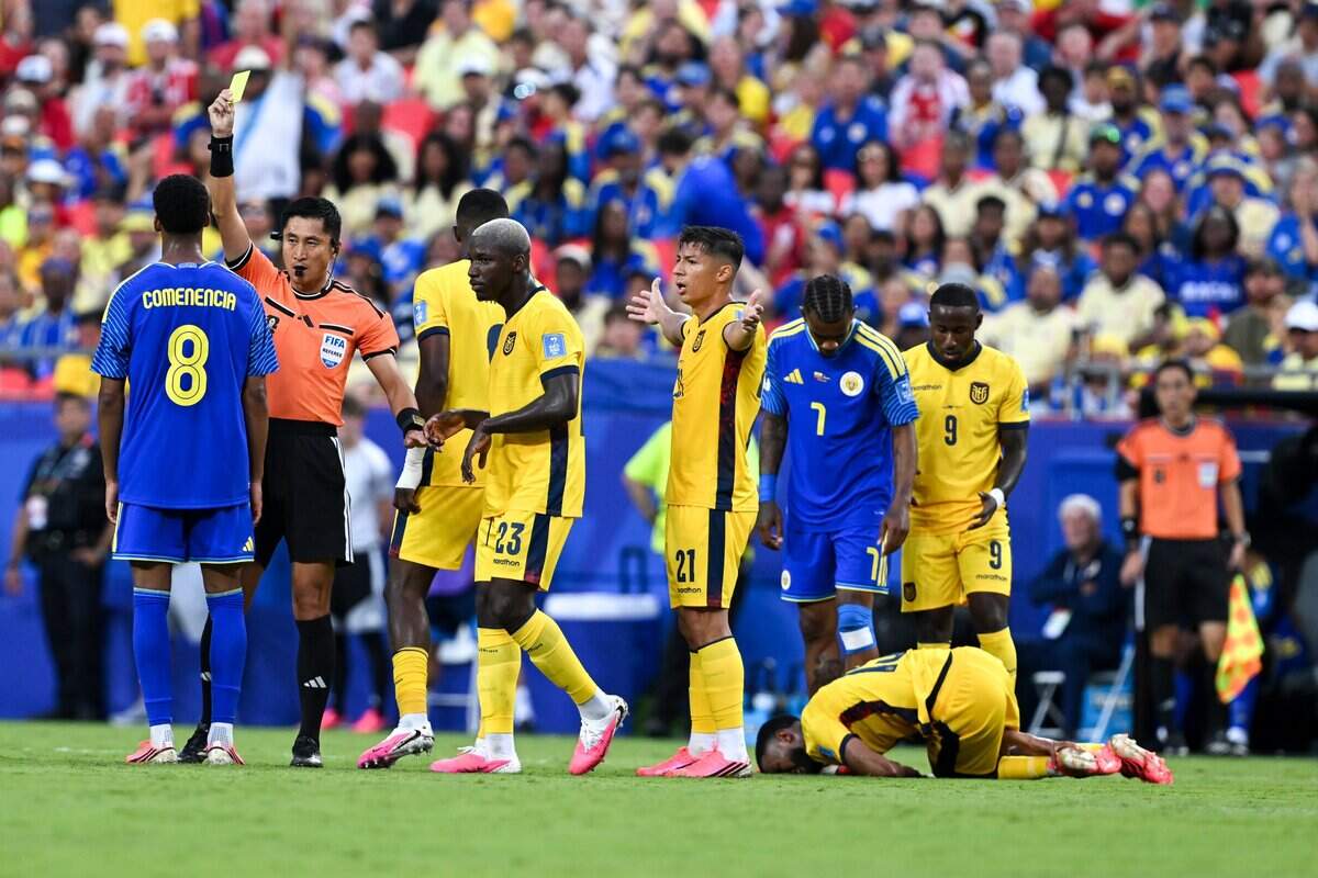 Curaçao defender Livano Comenencia (8) is given a yellow card in the second half of the Ecuador vs. Curaçao FIFA World Cup group-stage soccer match at Kansas City (Arrowhead) Stadium in Kansas City on Saturday, June 20, 2026.