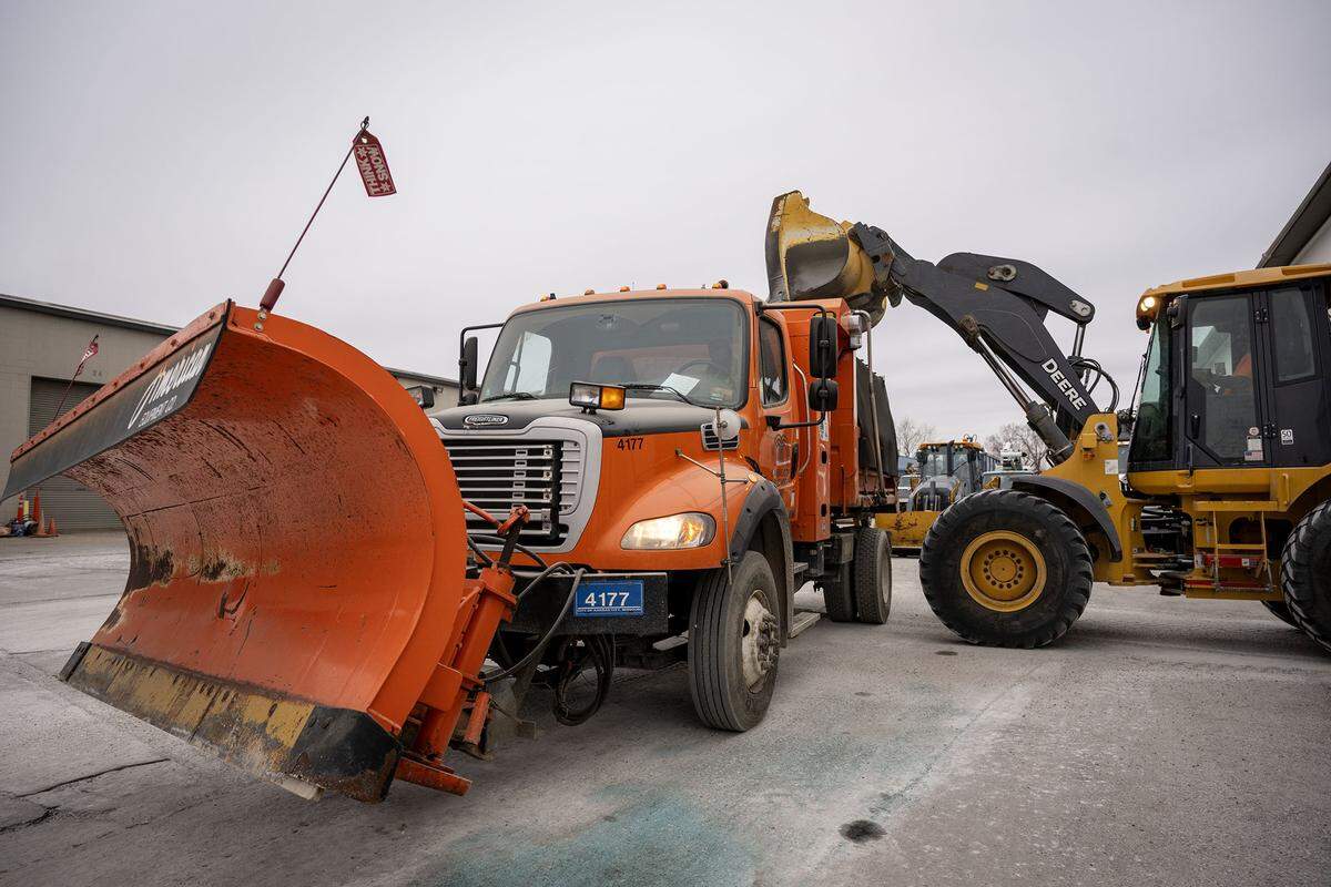 A snow plow driver for Kansas City Public Works waited as a front end loaded dumped a load of salt into his truck as the city prepared for a major winter storm. 