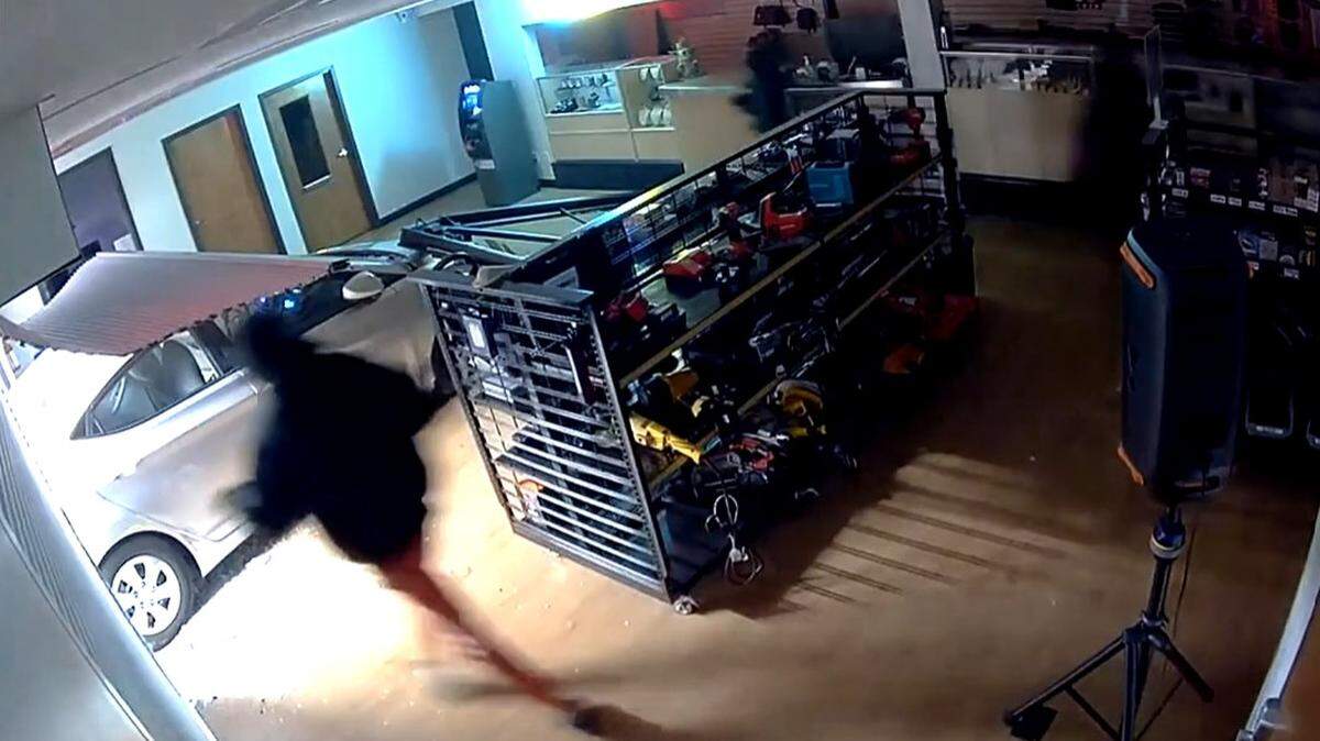 Authorities are investigating a Sunday morning burglary at an Overland Park pawn shop in which nearly 30 guns were stolen.
