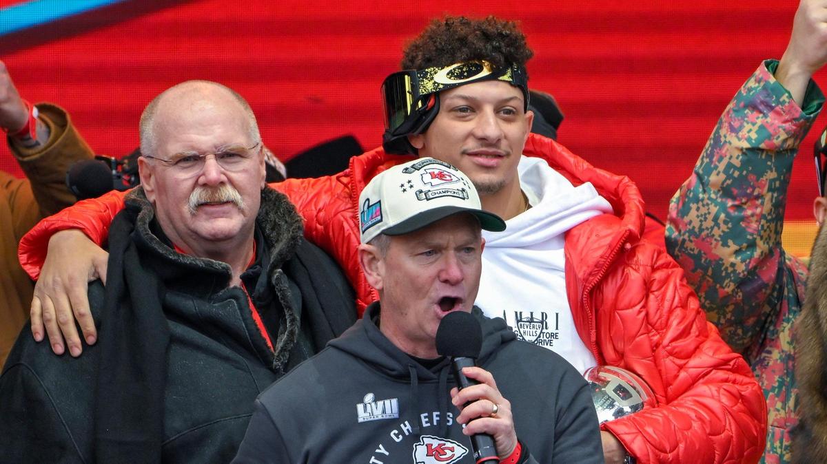 Mitch Holthus, play-by-play announcer for the Kansas City Chiefs, addressed the crowd as Chiefs head coach Andy Reid and quarterback Patrick Mahomes looked on at Union Station during the Super Bowl Champions rally on Wednesday, Feb. 15, 2023, in Kansas City.