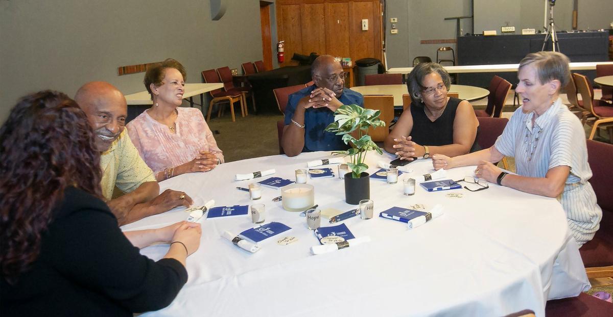 Alex and Alice Ellison, second from left, talked about the need for progress at the event Wednesday.
