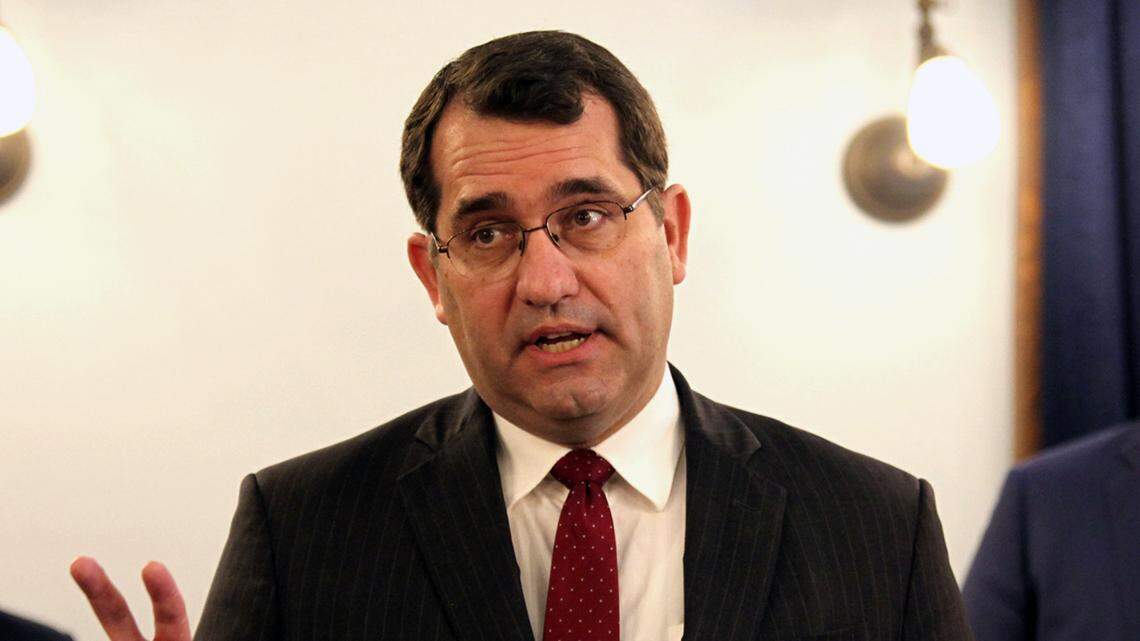 Kansas Attorney General Derek Schmidt discusses a proposal that he’s pushing with other Republicans to amend the state constitution to give the Legislature the power to overturn state agencies’ administrative regulations, at a news conference, Tuesday, Feb. 23, 2021, at the Statehouse in Topeka, Kan. Behind him are Senate President Ty Masterson, left, R-Andover, and House Speaker Ron Ryckman Jr., right, R-Olathe. (AP Photo/John Hanna)