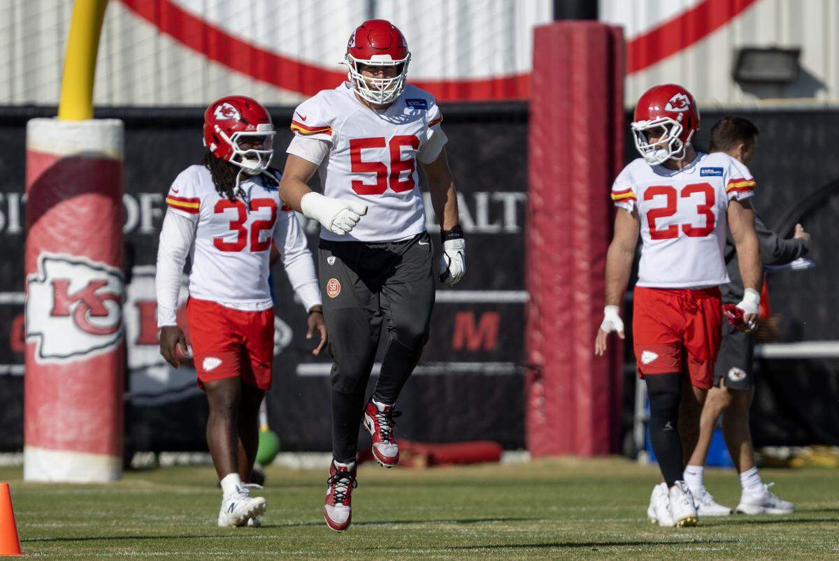 Chiefs linebacker Nick Bolton (No. 32), defensive end George Karlaftis (No. 56) and linebacker Drue Tranquill (No. 23) loosen up during practice on Friday, Nov. 14, 2025, in Kansas City.