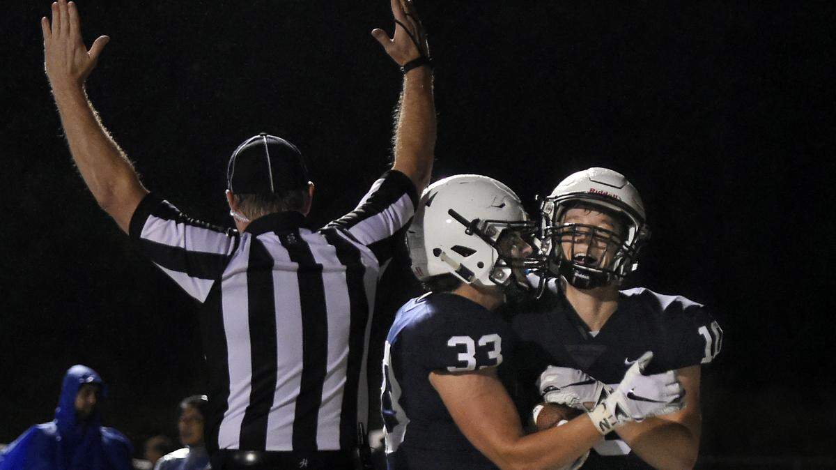 Wide receiver Jayce Zukowski (right) celebrated with teammate Trevor Wieschhaus after catching a touchdown pass that tied the score 13-13 with 1:31 left on the clock on Friday evening, Sept. 7, in their game against St. James Academy at Mill Valley High School, 5900 Monticello Road in Shawnee. The extra point sealed the victory for Mill Valley, 14-13.