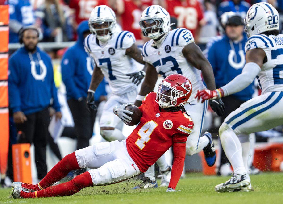 Kansas City Chiefs wide receiver Rashee Rice (4) slides into a first down in the second half against the Indianapolis Colts on Sunday, Nov. 23, 2025 at GEHA Field at Arrowhead Stadium in Kansas City. The Chiefs defeated the Colts 23-20 in overtime. 