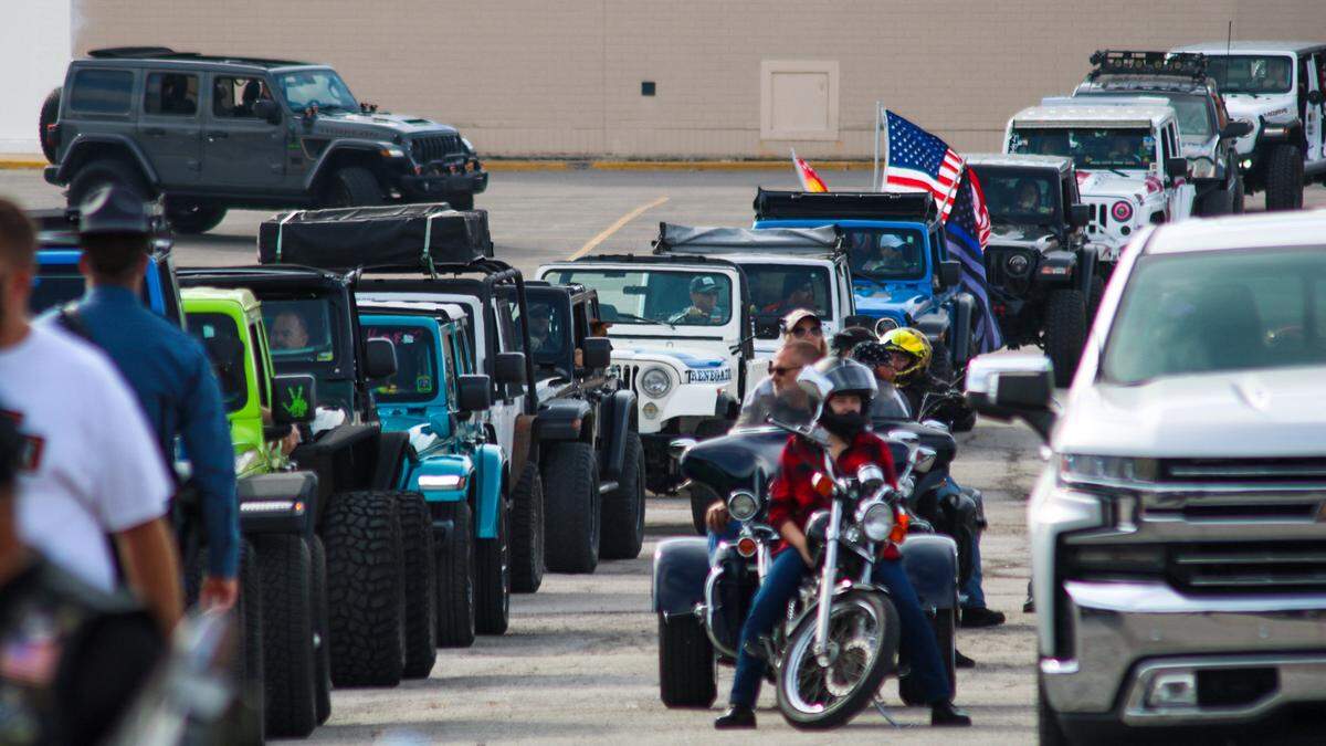 Jeeps and motorcycles wait their turn in line for a parade honoring Tucker Langford, a Kansas City 3-year-old who was diagnosed with a terminal illness in August.