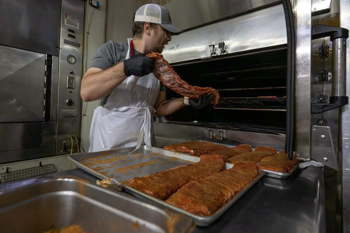 Ribs are put into a smoker at Joe's KC BBQ on Thursday, April 30, 2026, in Kansas City, Kansas.