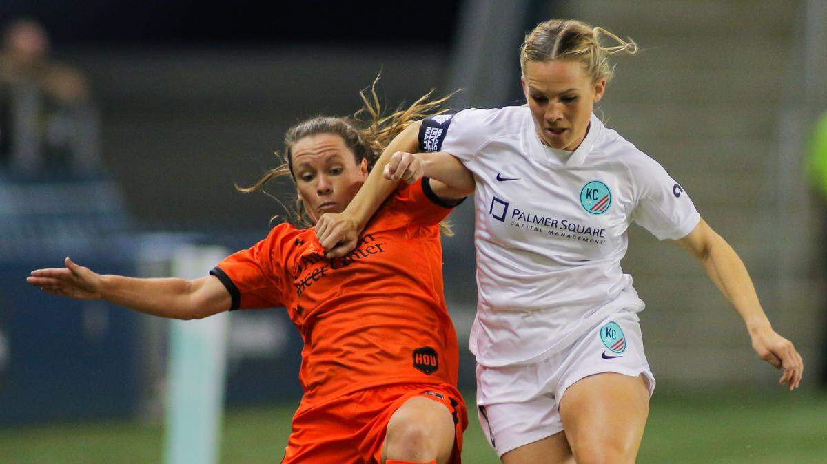 KC NWSL captain Amy Rodriguez tries to fend off Allysha Chapman of the Houston Dash during Monday night’s home opener for Kansas City at Children’s Mercy Park in Kansas City, Kan.