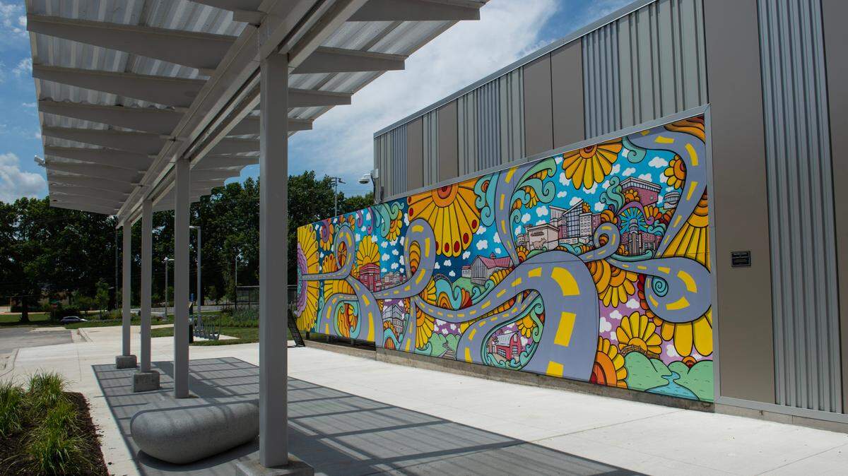 The mural on the Lenexa Old Town Activity Center pays homage to Old Town Lenexa and the newer City Center development.