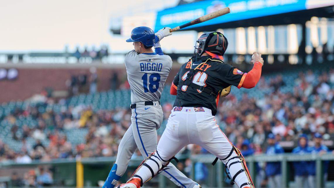 Kansas City Royals first baseman Cavan Biggio (18) strikes out and San Francisco Giants catcher Patrick Bailey (14) throws out Kansas City Royals third baseman Maikel Garcia (11) at second base during the second inning at Oracle Park on May 20, 2025.
