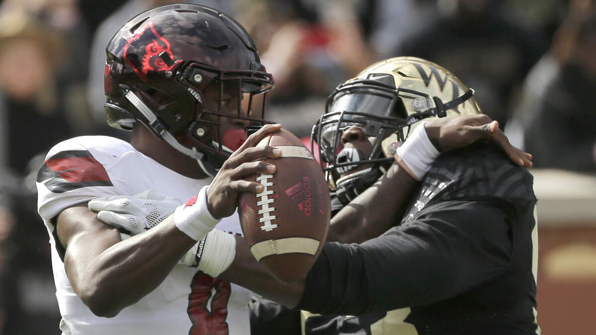Wake Forest's Duke Ejiofor (right) put a sack on Louisville's Lamar Jackson in a game last season.