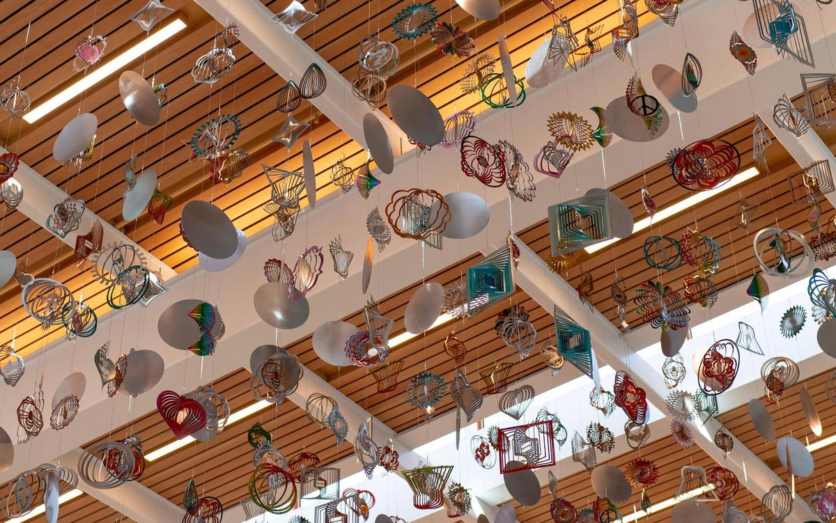 Artwork by Nick Cave titled “The Air Up There” hangs inside the new Kansas City International Airport terminal.