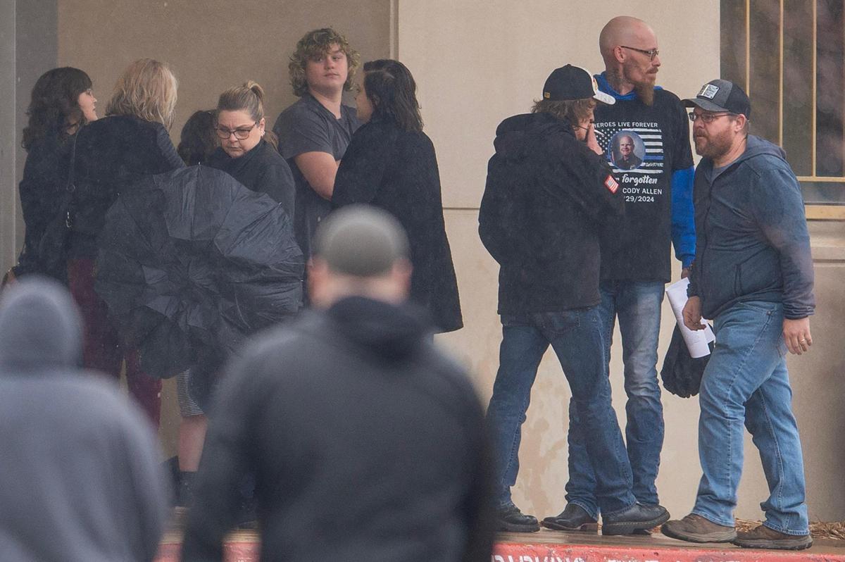 Members of the community arrive to pay their respects to fallen Independence police officer Cody Allen during a visitation at Community of Christ on Thursday, March 7, 2024, in Independence. Allen, 35, a husband and father of two children, was shot and killed last Thursday during an eviction in Independence.