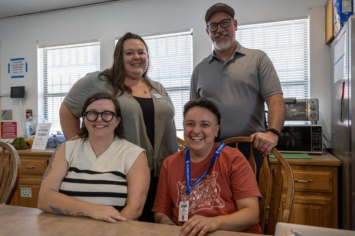 Mary Brewster, left, assistant director of programs and services, Patrick McLaughlin, CEO of Save Inc., Cara Ramsey, director of programs and services, and Anali Otazo, program manager, smile for a portrait at Teresa's Place on Thursday, Sept. 11, 2025, in Kansas City.