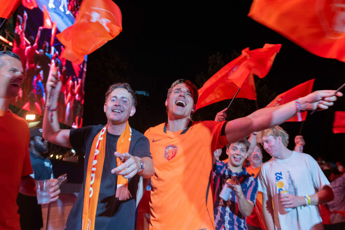 Dutch fans wave their flags and cheer as they celebrate their team during the Bij Oranje Party at Fan Fest on Wednesday, June 24, 2026.