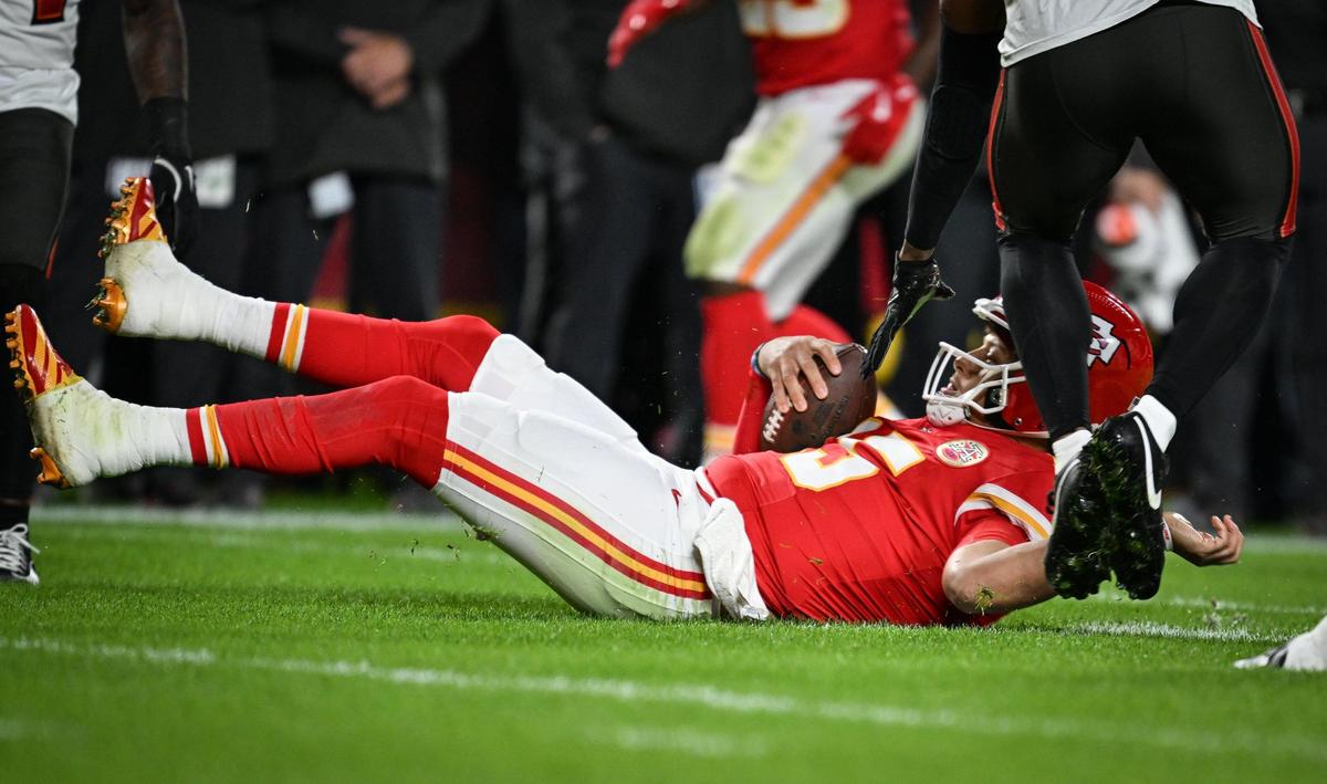 Kansas City Chiefs quarterback Patrick Mahomes (15) lands on his back after being sacked by Tampa Bay Buccaneers defensive tackle Vita Vea (50) in the first quarter on Monday, Nov. 4, 2024, at GEHA Field at Arrowhead Stadium.